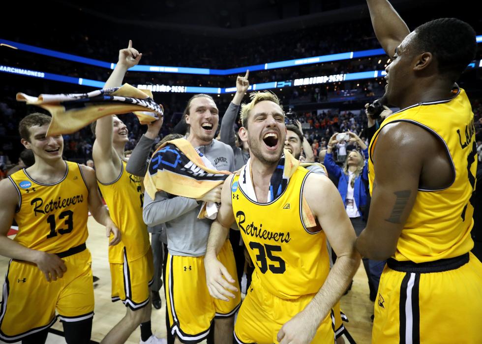  The UMBC Retrievers bench reacts to their 74-54 victory over the Virginia Cavaliers.