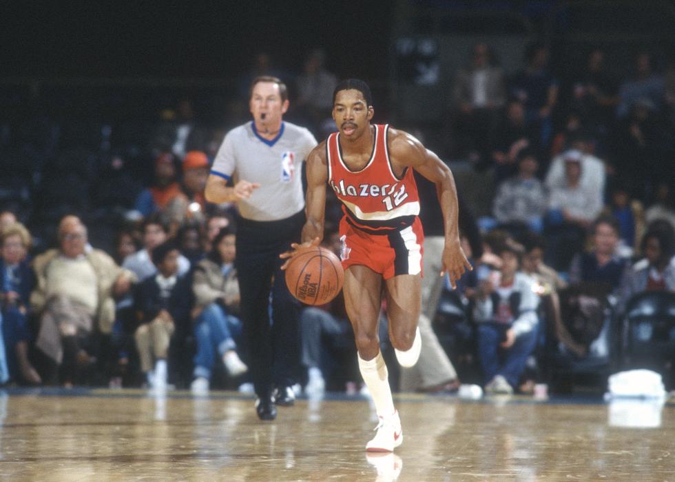 Fat Lever of the Portland Trail Blazers dribbles the ball up court.