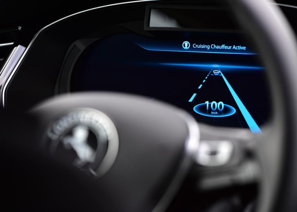 A close up of a digital display, which says Cruising Chauffeur Active, during tests of autonomous car abilities.