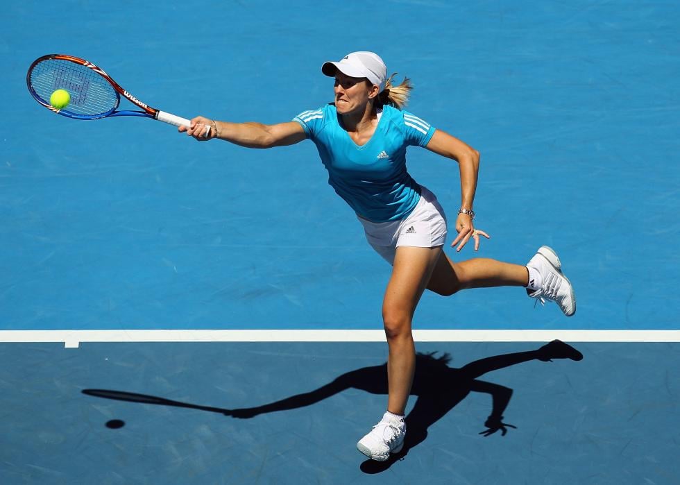 Justine Henin of Belgium plays a forehand