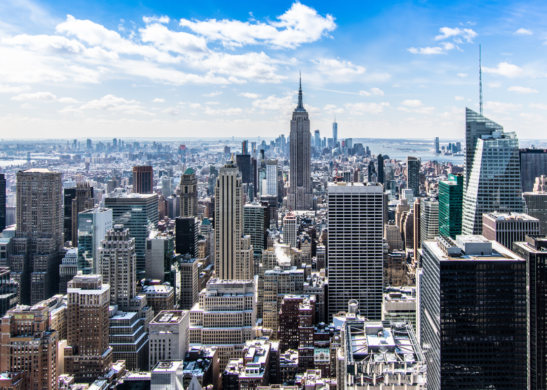 An aerial view of the Empire State Building and surrounding buildings. 