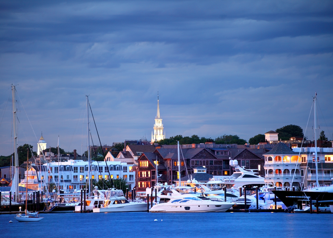 Large boats and buildings on the water in Newport.