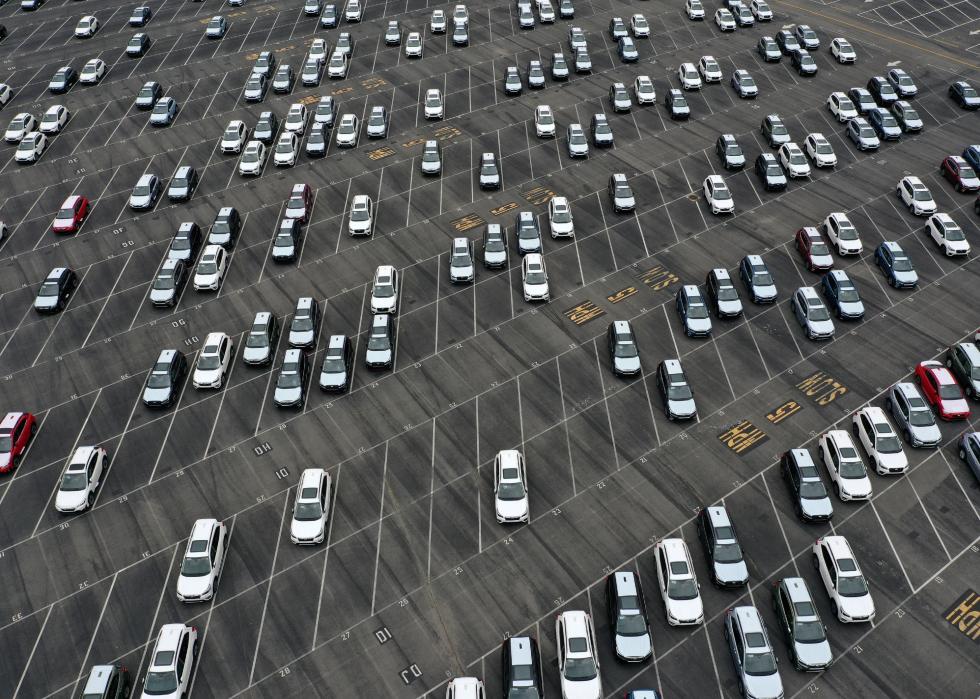 An aerial view of brand new Subaru cars in a half-empty storage lot at Auto Warehouse Co. in California in 2021.
