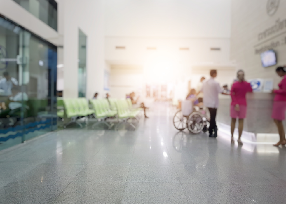 Hospital staff in front of a check in desk.