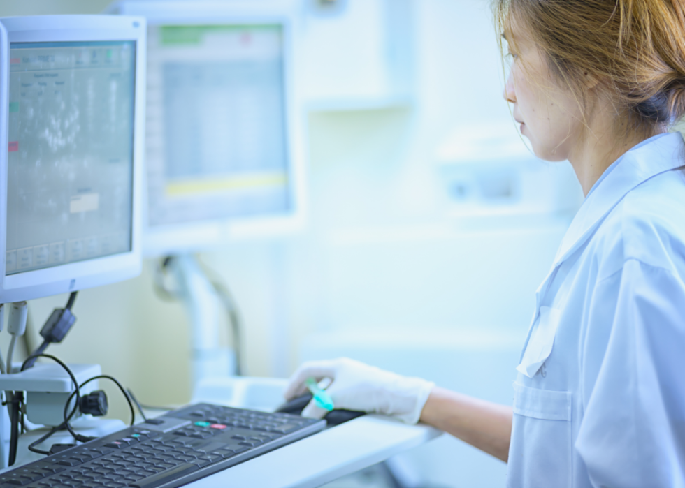 Hospital staffer looking at a computer.