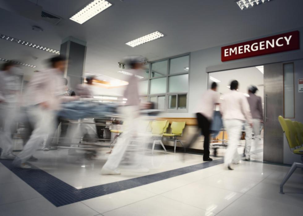 Hospital staff running into emergency department.