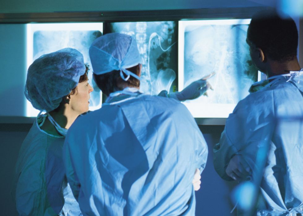 Surgeons examining x-rays.