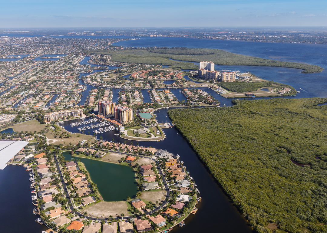 An aerial view of homes on the water.