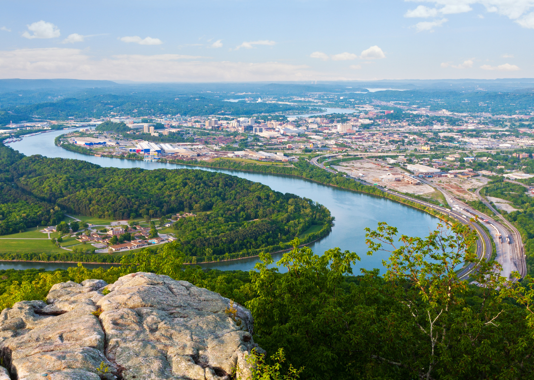 Chattanooga, Tennessee, aerial view of buildings, the river and homes from a cliff.