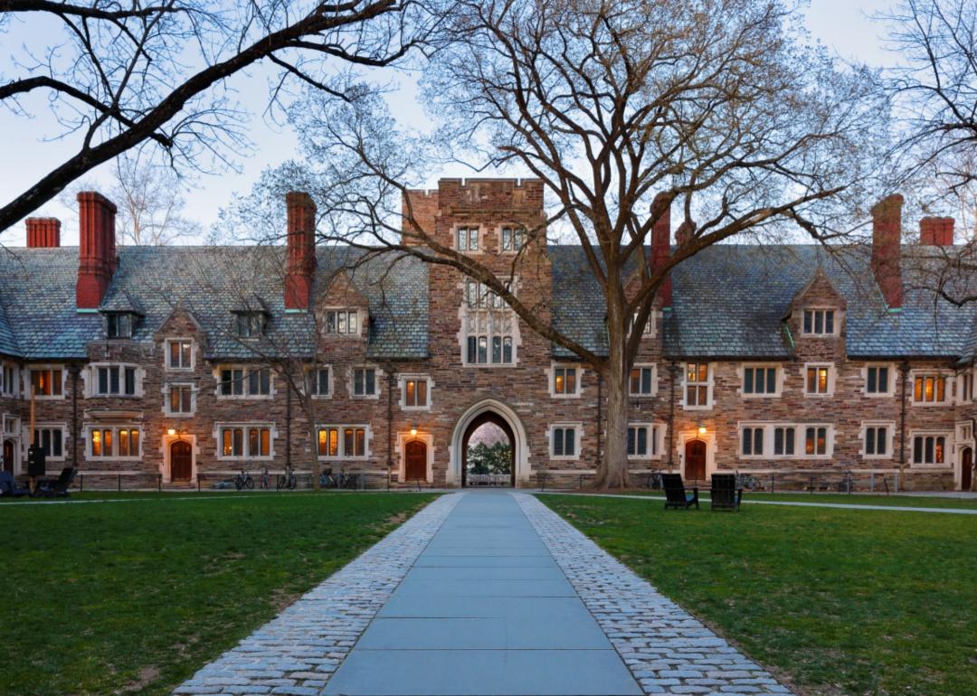 Holder Hall on the campus of Princeton University after sunset.