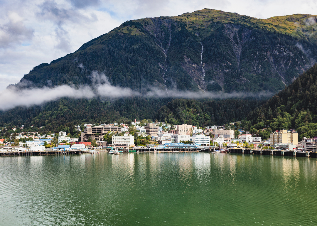 Downtown Juneau on the water with mountains in the background.