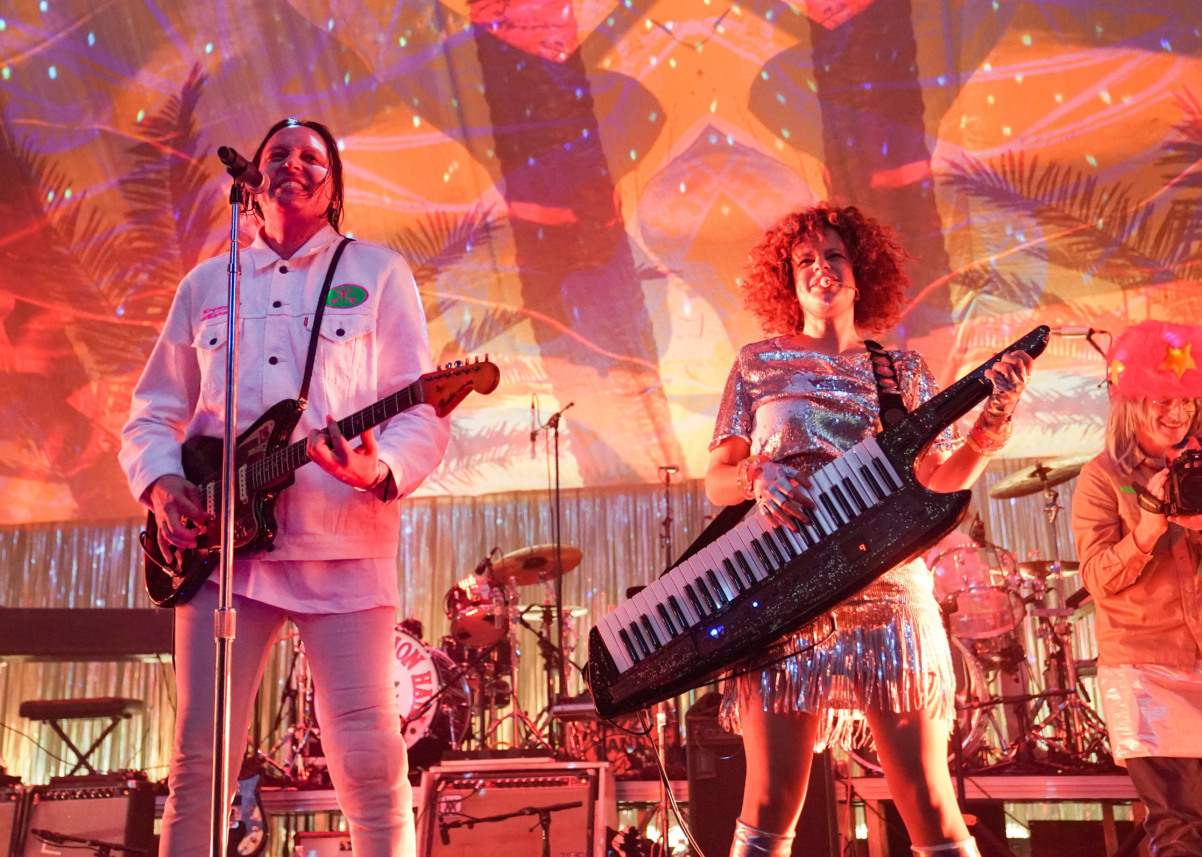 Arcade Fire performing onstage.