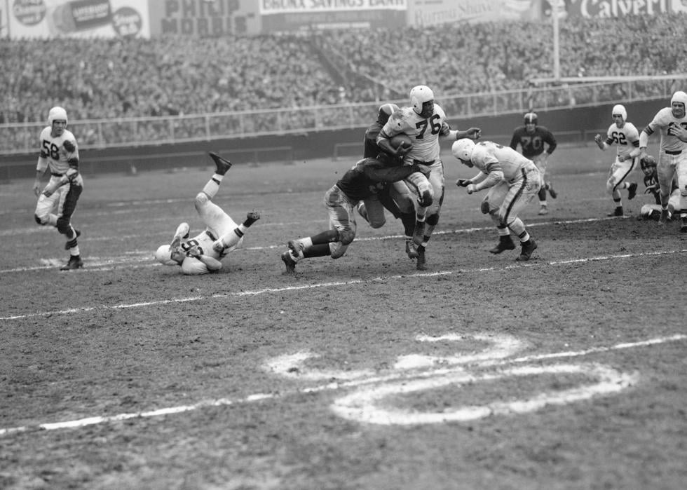 Marion Motley, Cleveland Browns Fullback number 76 in the 2nd quarter of a game with the New York Giants at Yankee Stadium, Nov. 23, 1947. 