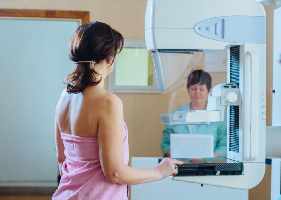 Woman preparing for mammogram.