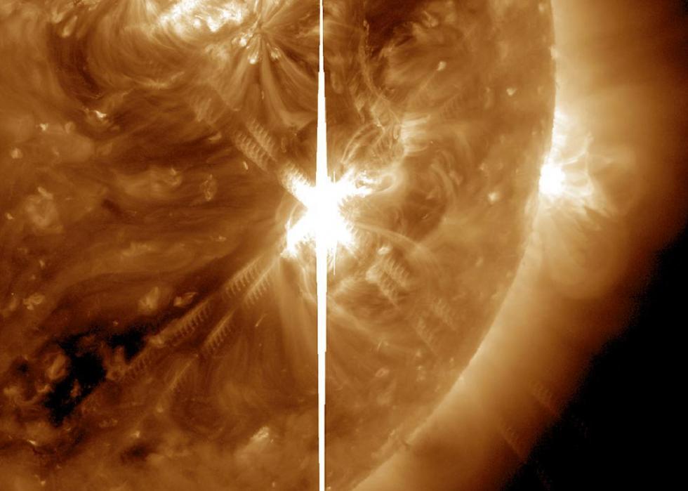 Pictured: The bright vertical line and the other rays with barred lines are aberrations caused by the bright flash of the solar flare in a sunspot, 2017.