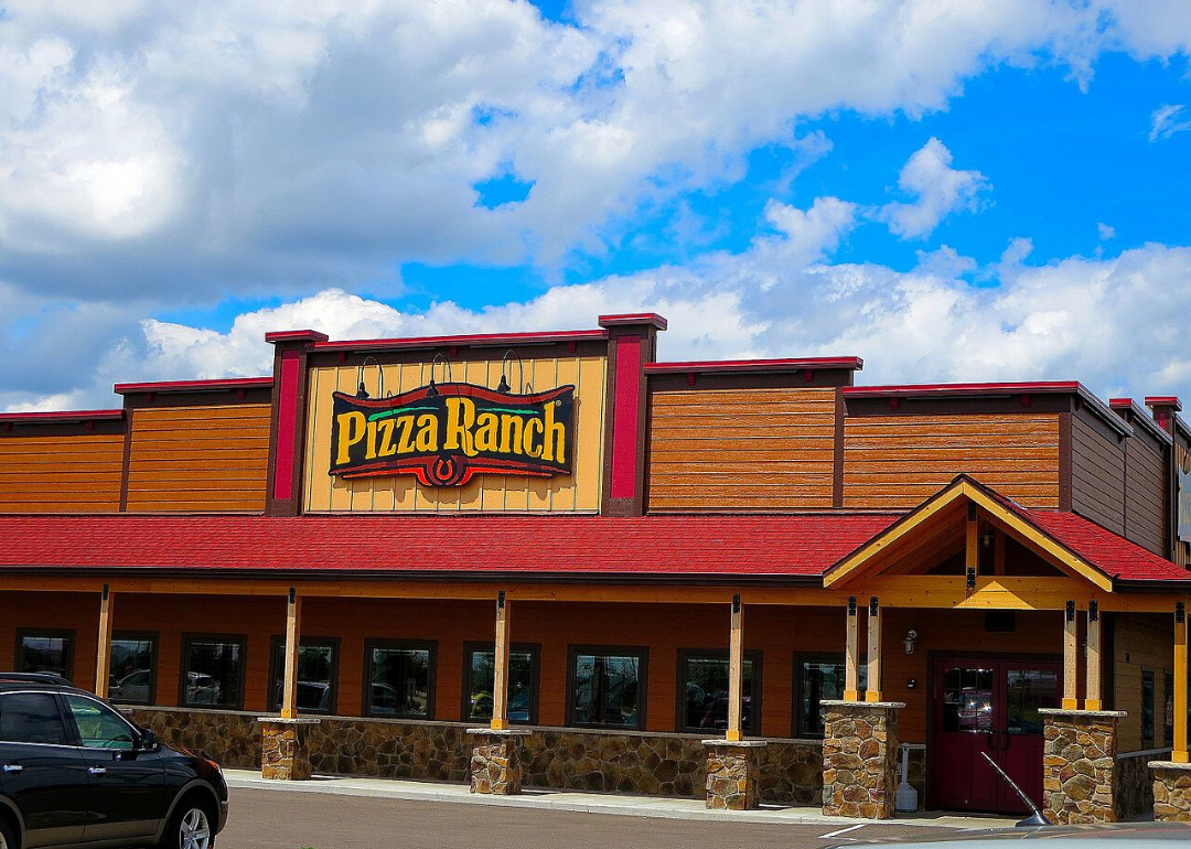 A western style wooden Pizza Ranch restaurant.