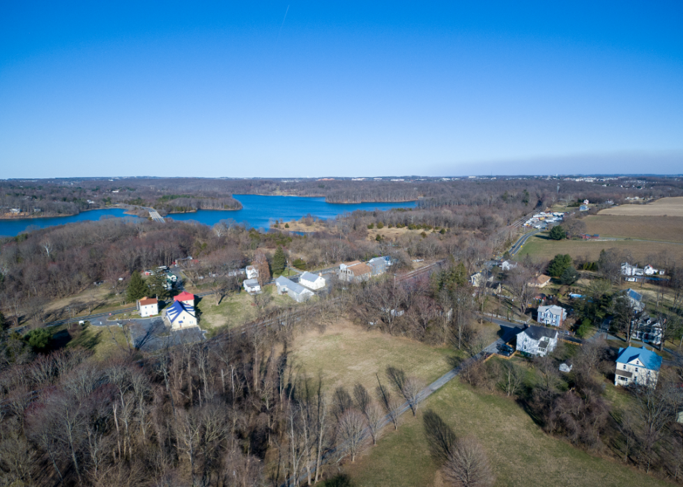 An aerial view of homes near the water.