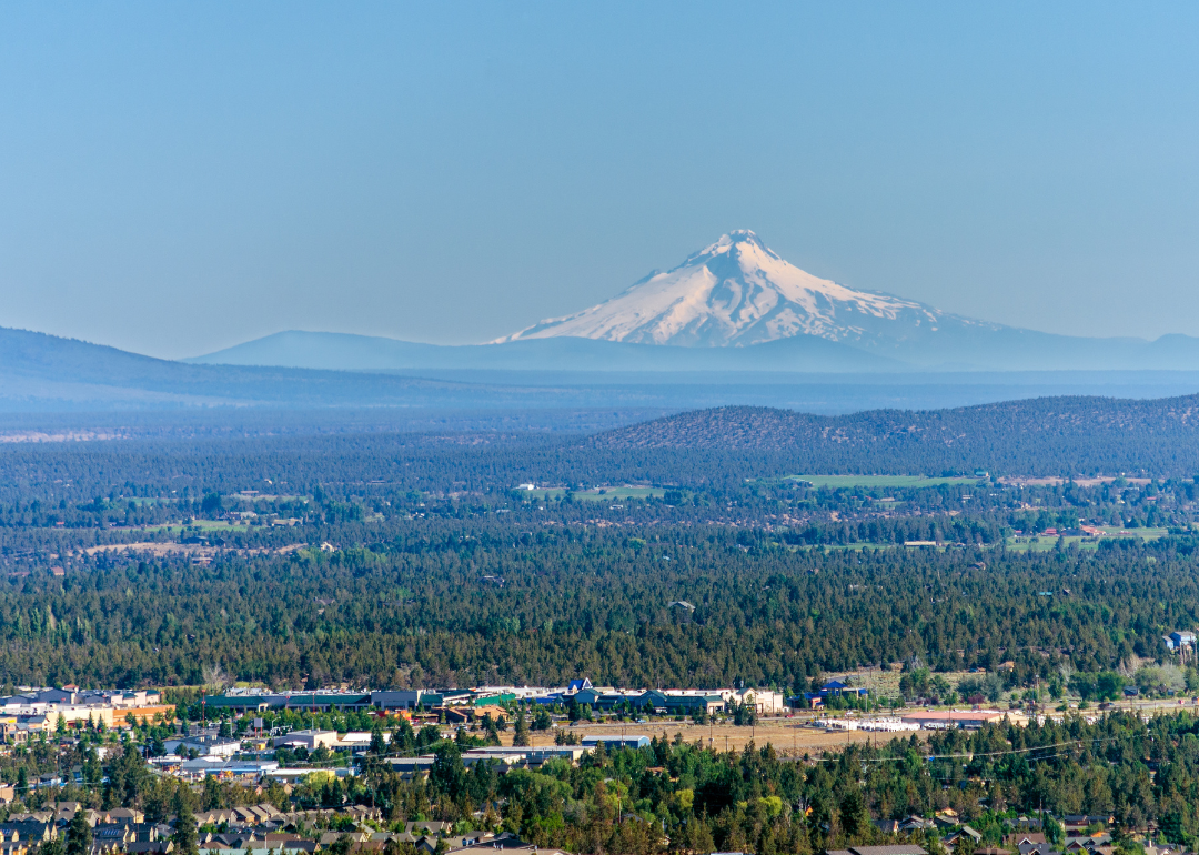 An aerial view of Bend with Mt. Hood in the background.