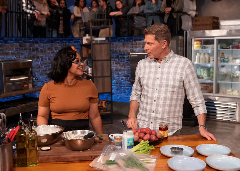 Bobby Flay with contender Adyre Mason as she cooks