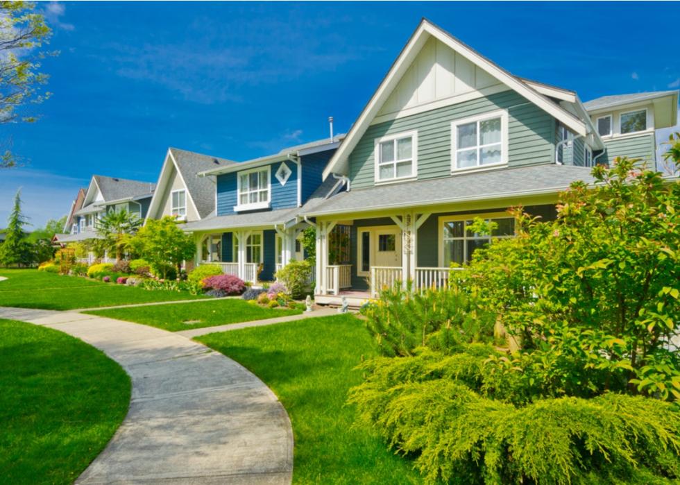 Lush landscaping surrounding craftsman homes.