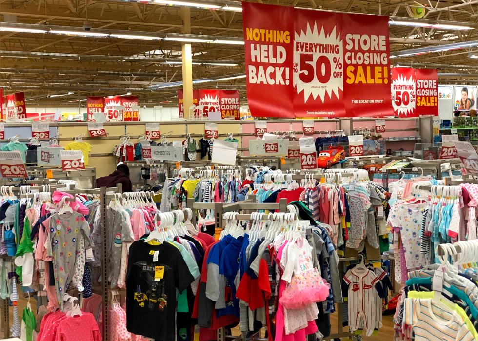 A Kids R Us store closing sale filled with clothing and toys.