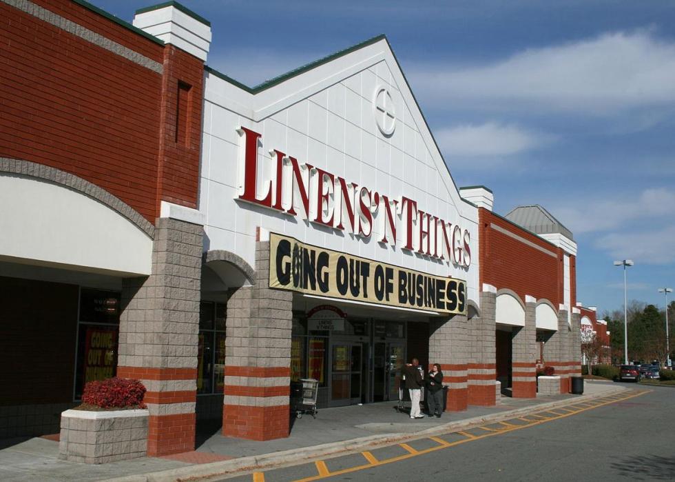 A white and red brick exterior of Linens 'n Things.