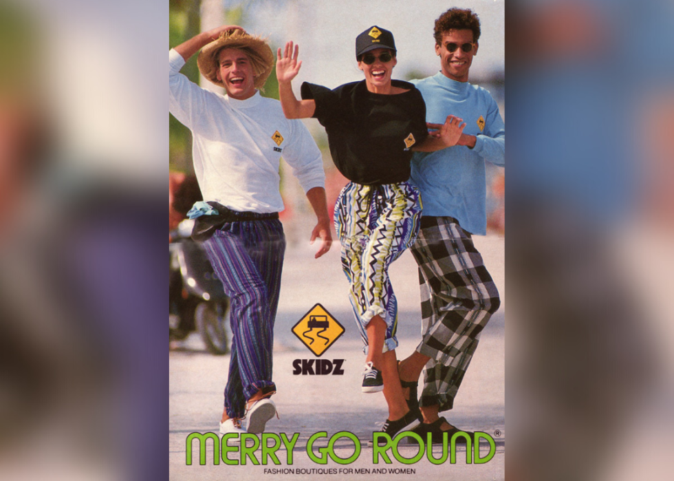 A group of models smiling while walking down the street in an ad for Merry-Go-Round.