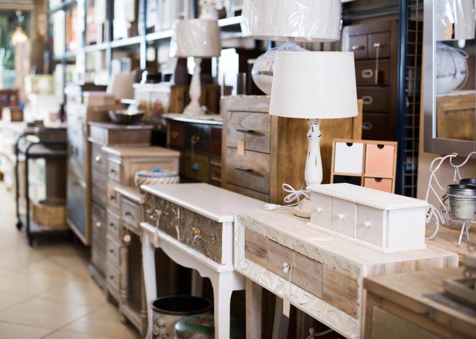 Wooden furniture for sale in a store.