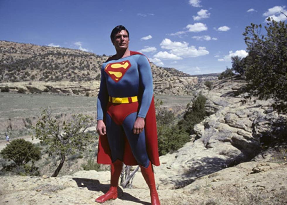 Superman standing on a mountain.
