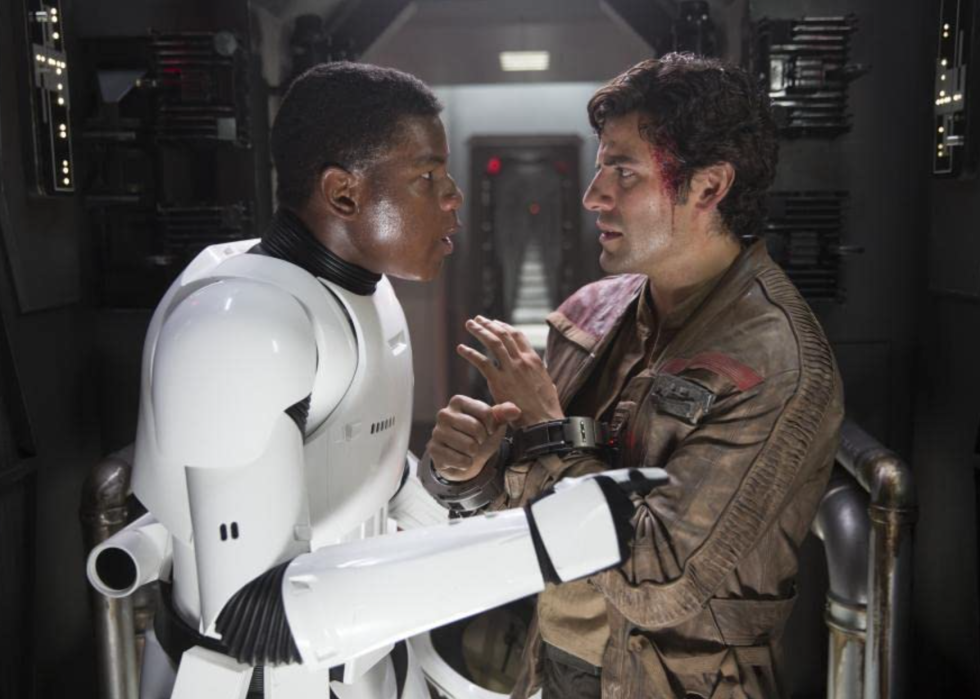 Storm trooper in white armor confronting a roughed up rebel.