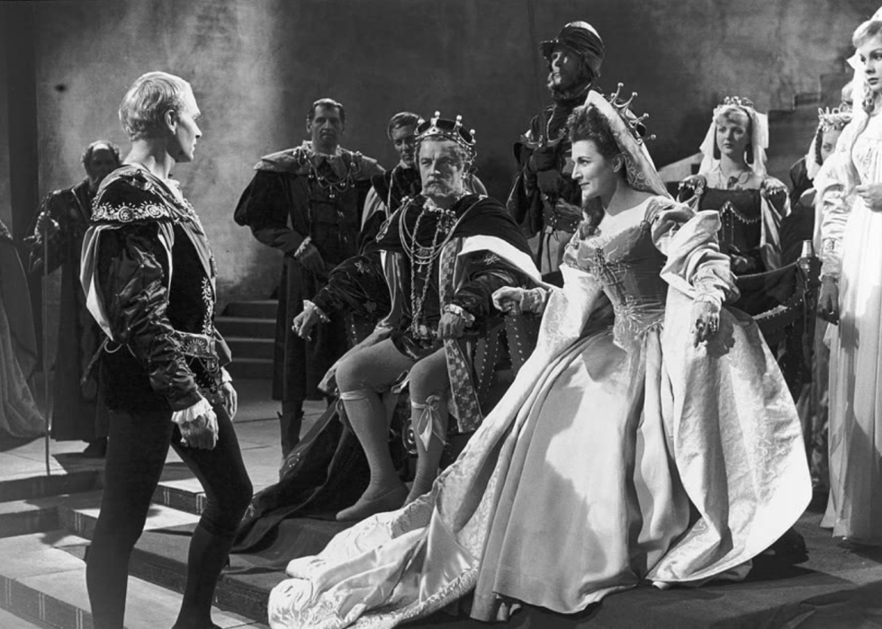 Laurence Olivier, Jean Simmons, Eileen Herlie, and Basil Sydney in a scene from "Hamlet"