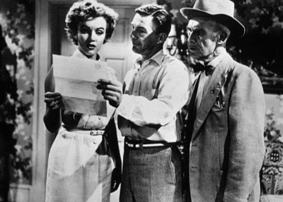 Marilyn Monroe, James Gleason, and David Wayne in a scene from "We're Not Married!"