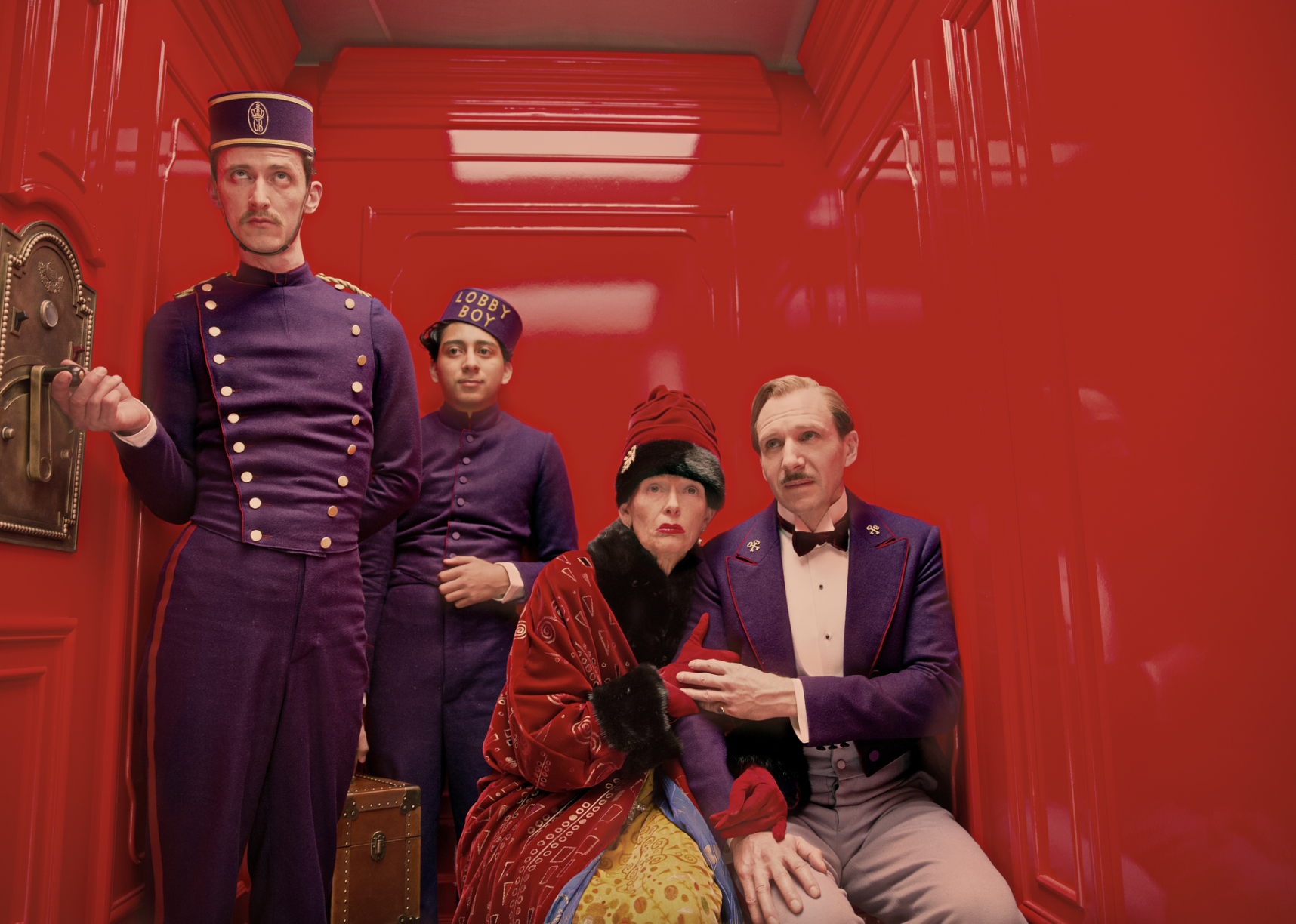 Ralph Fiennes, Tilda Swinton, Tony Revolori, and Paul Schlase in "The Grand Budapest Hotel"