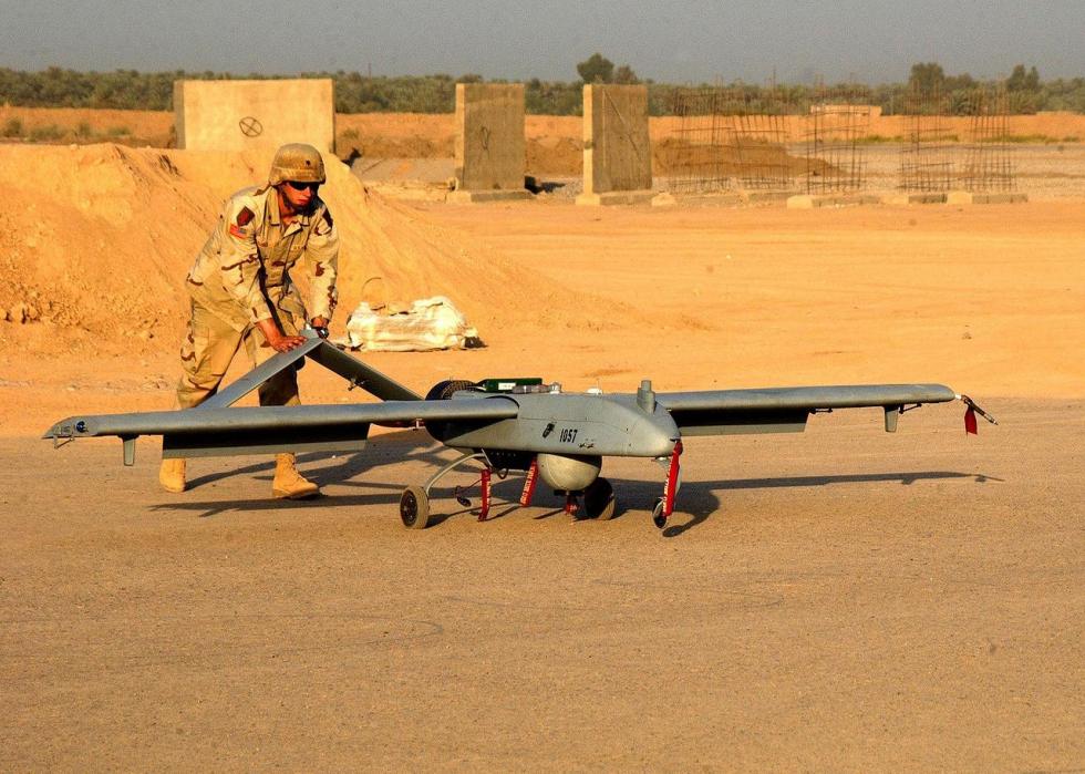 Pictured: Spc. Jeremy Squirres of Company A, 101st Military Intelligence Battalion, 3rd Brigade Combat Team, 1st Infantry Division, prepares a Shadow 200 Unmanned Aerial Vehicle for launch at Forward Operating Base Warhorse, Iraq
