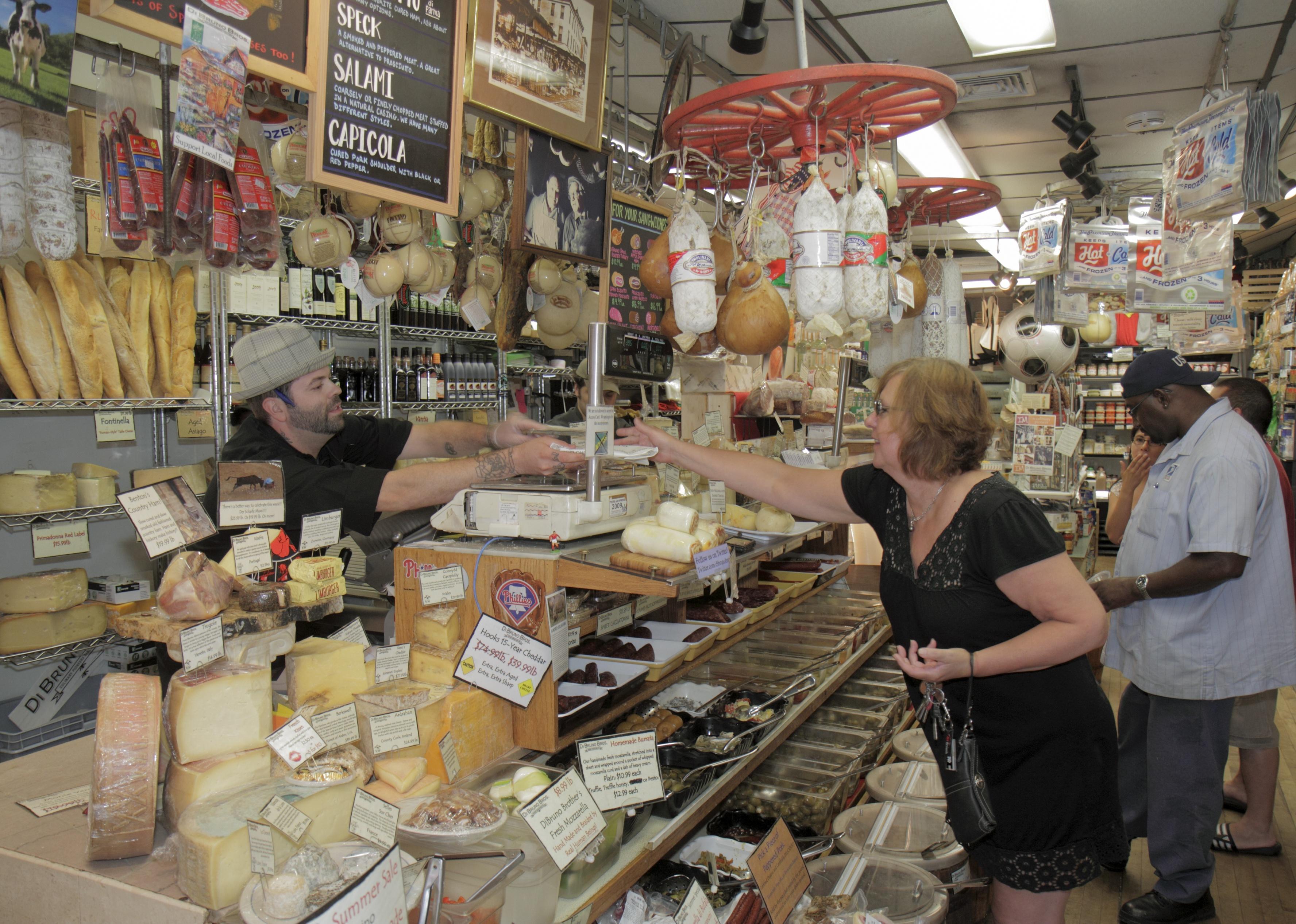 Patrons at a gourmet Italian market.