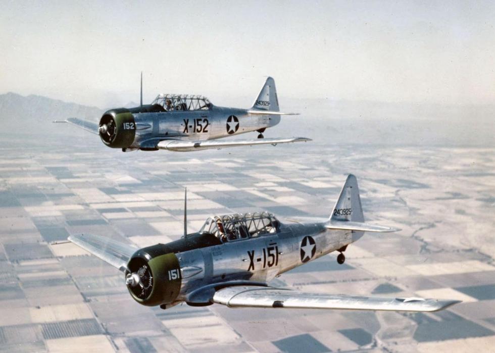 Pictured: Two U.S. Army Air Forces North American AT-6C-NT Texan trainers in flight near Luke Field, Arizona, 1943