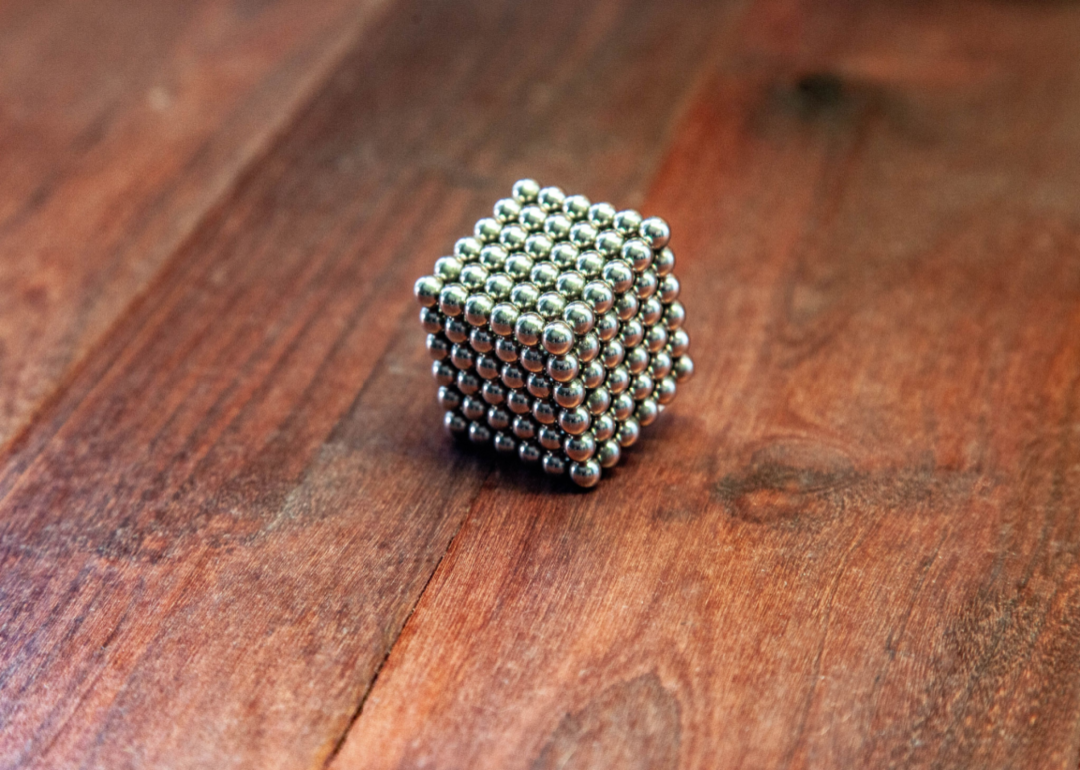 A square block made from silver magnet balls.