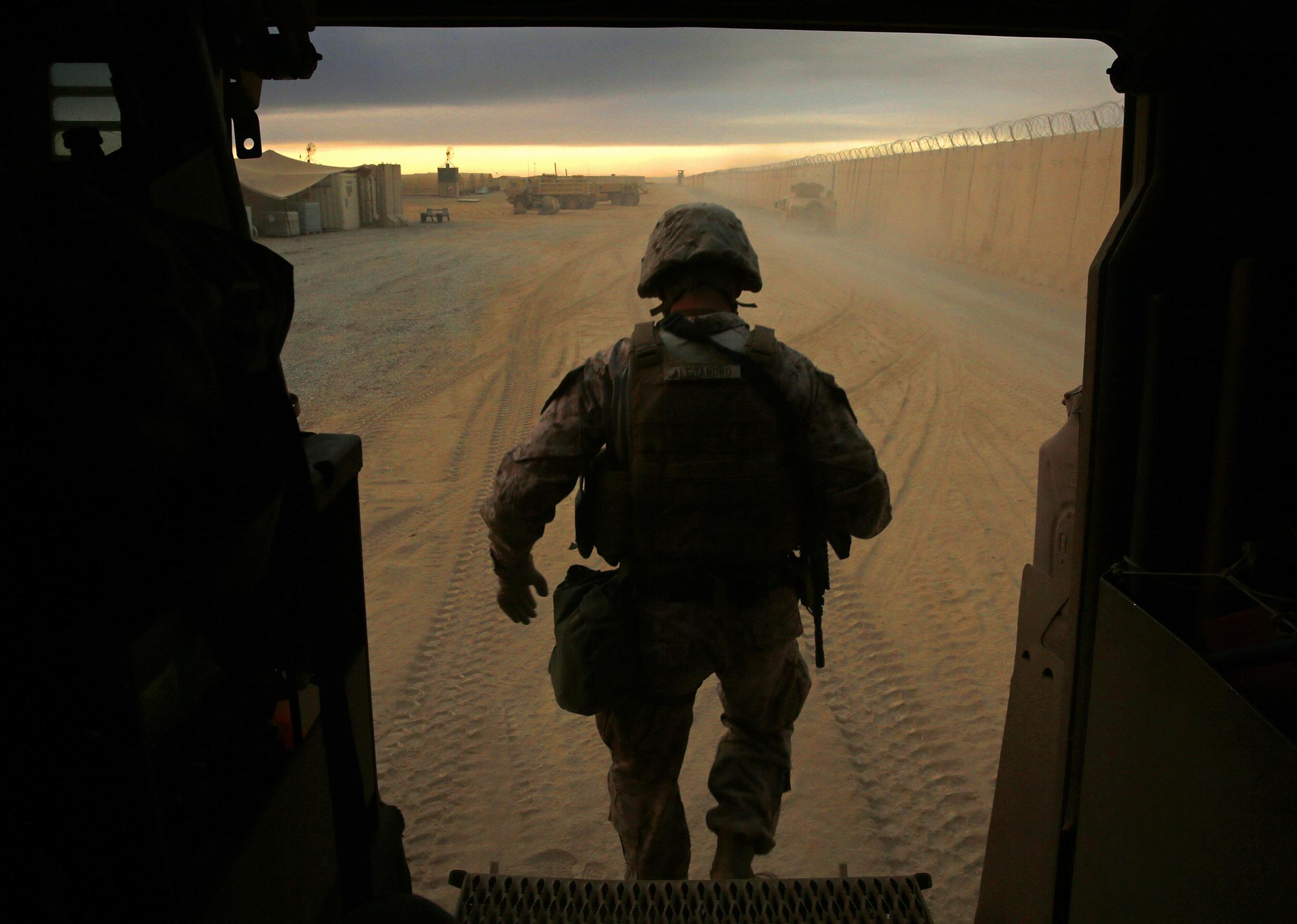 A U.S. soldier steps out of a bunker in Iraq.
