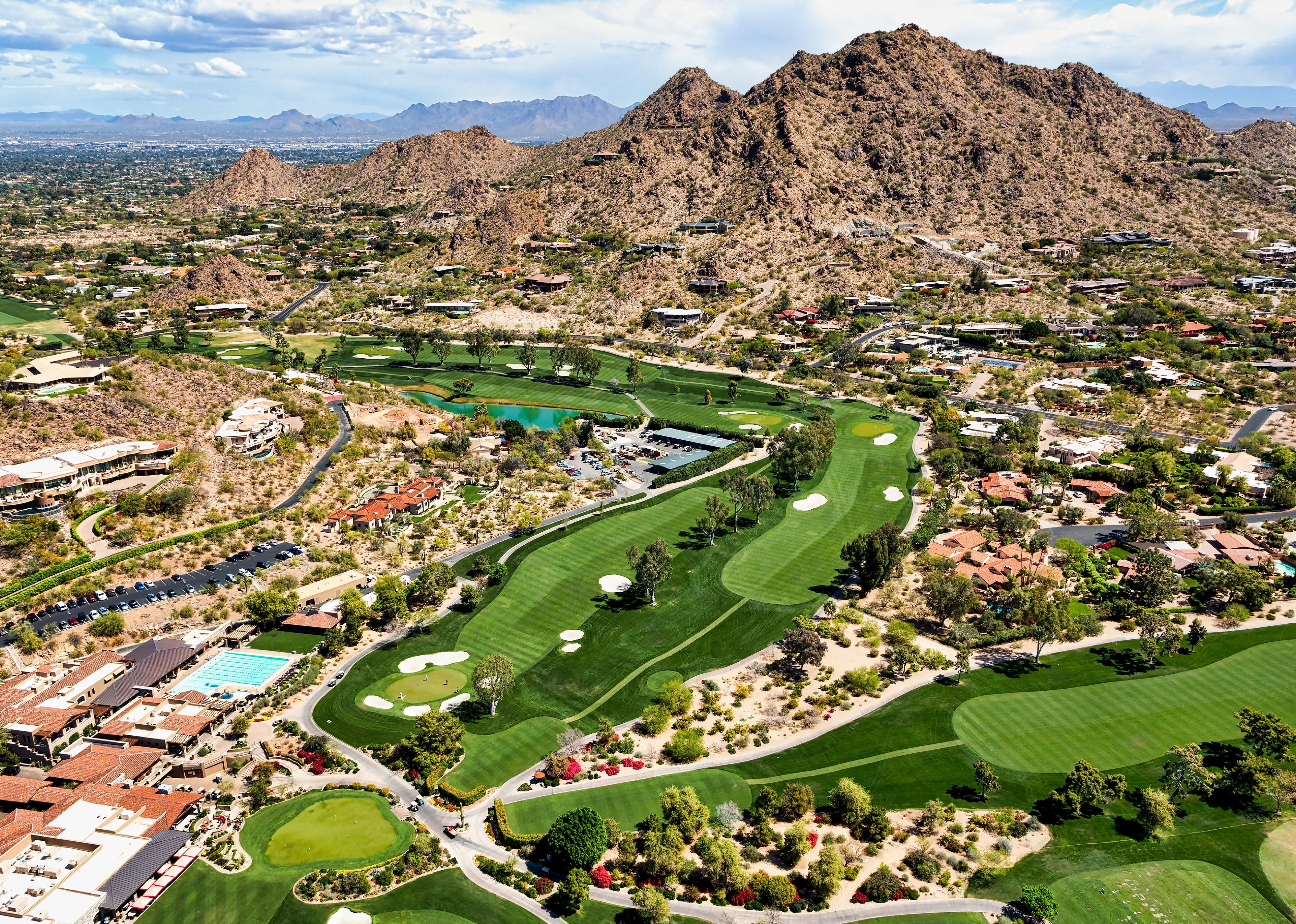 Aerial view of desert golf course community.