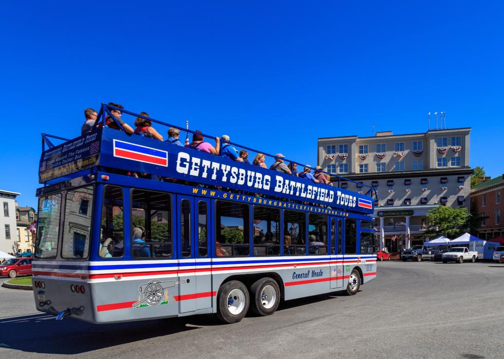 A Gettysburg battlefield tour bus travels through the center of town
