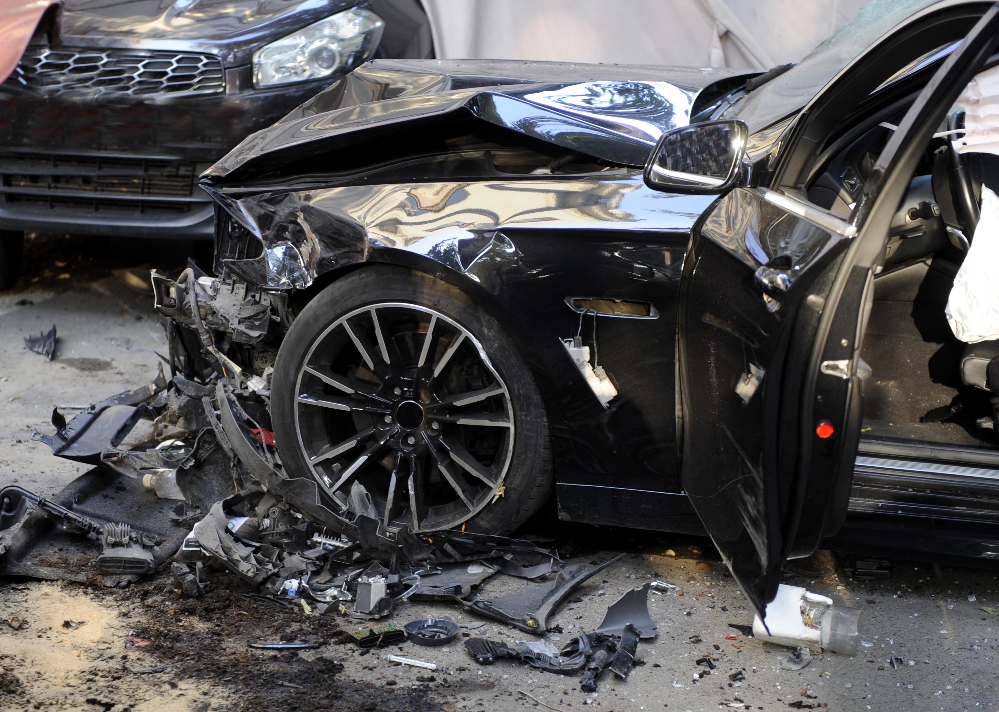 Close-up of destroyed car with deployed air bags.