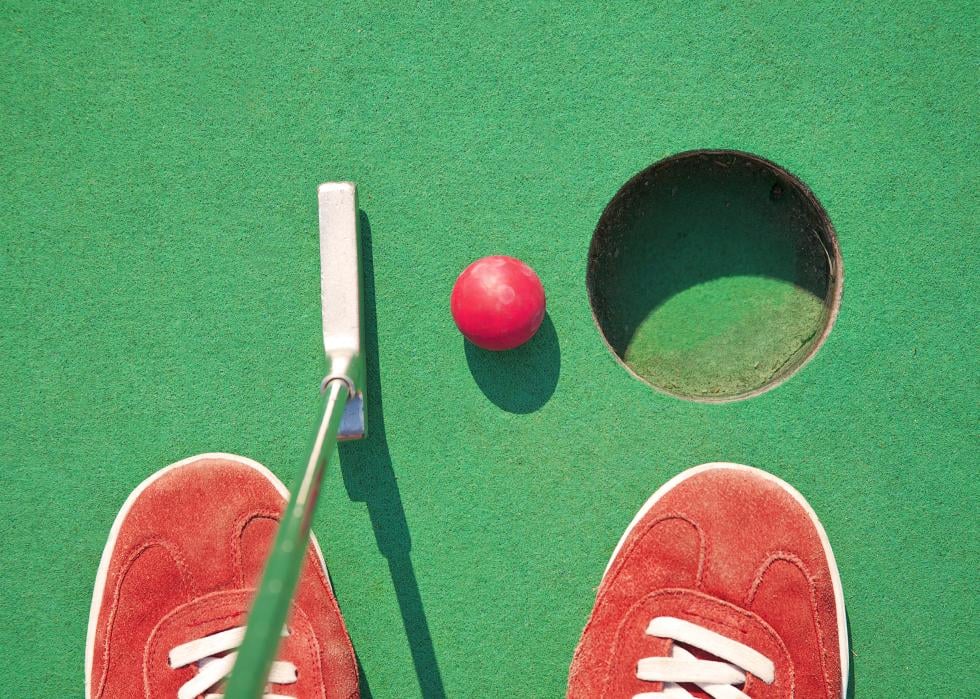 Close-up of miniature golf hole with ball