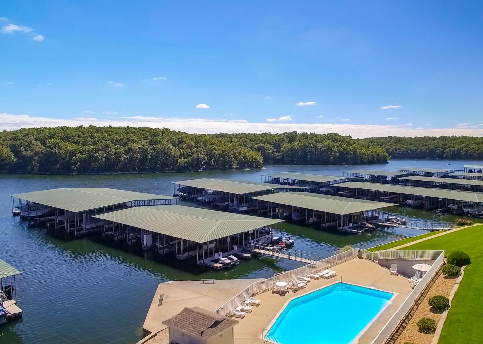 Poolside view of boats docked at lakeside condo on a sunny day at Lake of the Ozarks.