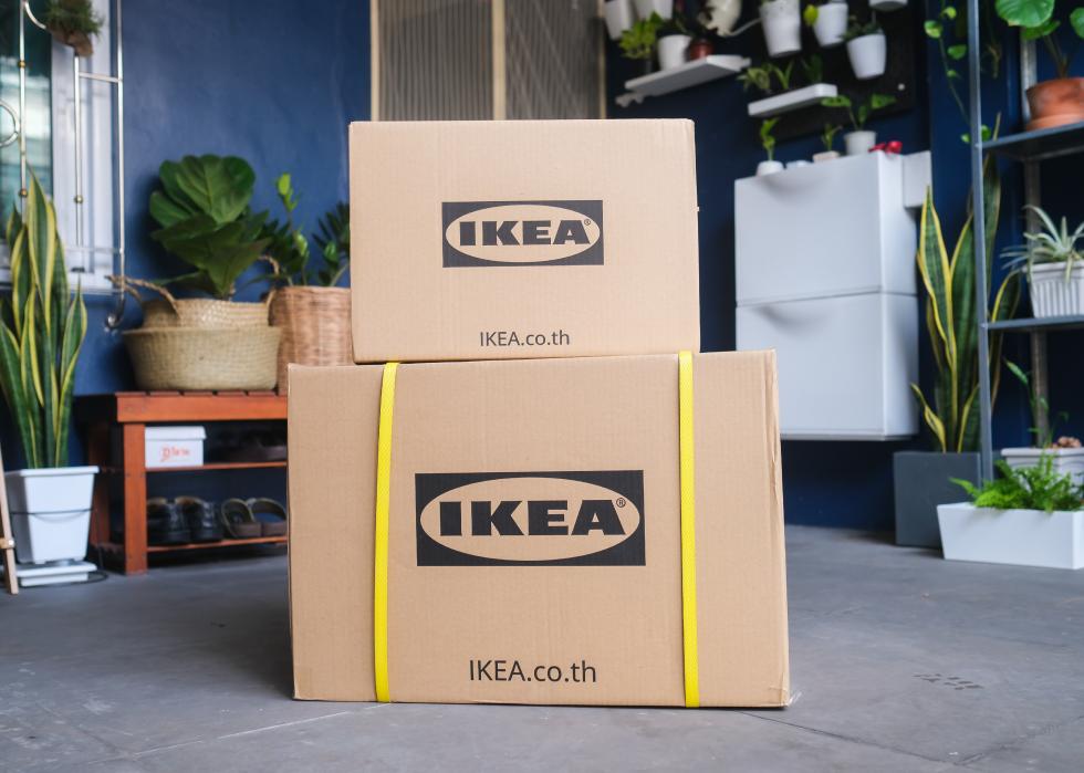 IKEA boxes stacked on a porch