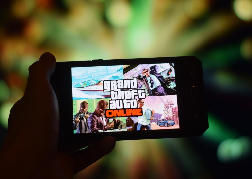 Closeup of Grand Theft Auto Online image game on smartphone.
