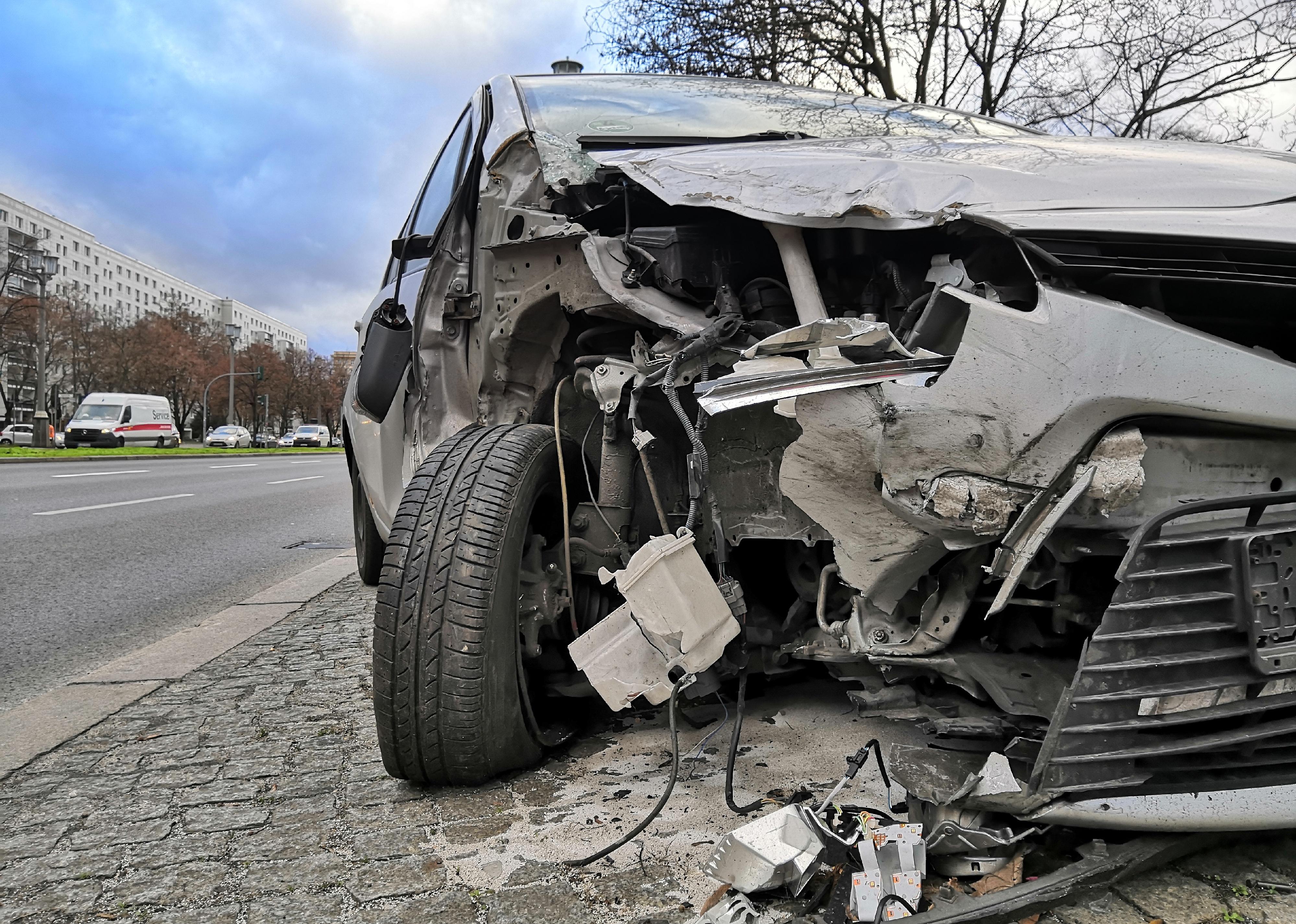 Destroyed front of a car after a crash.