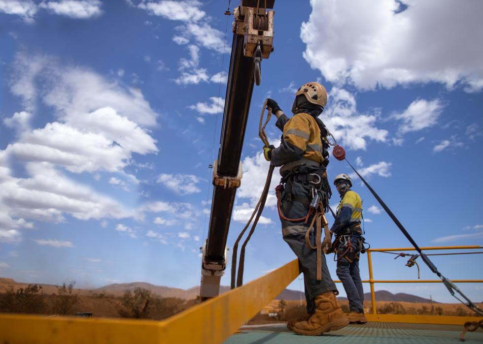 Rigger attaching a hook.