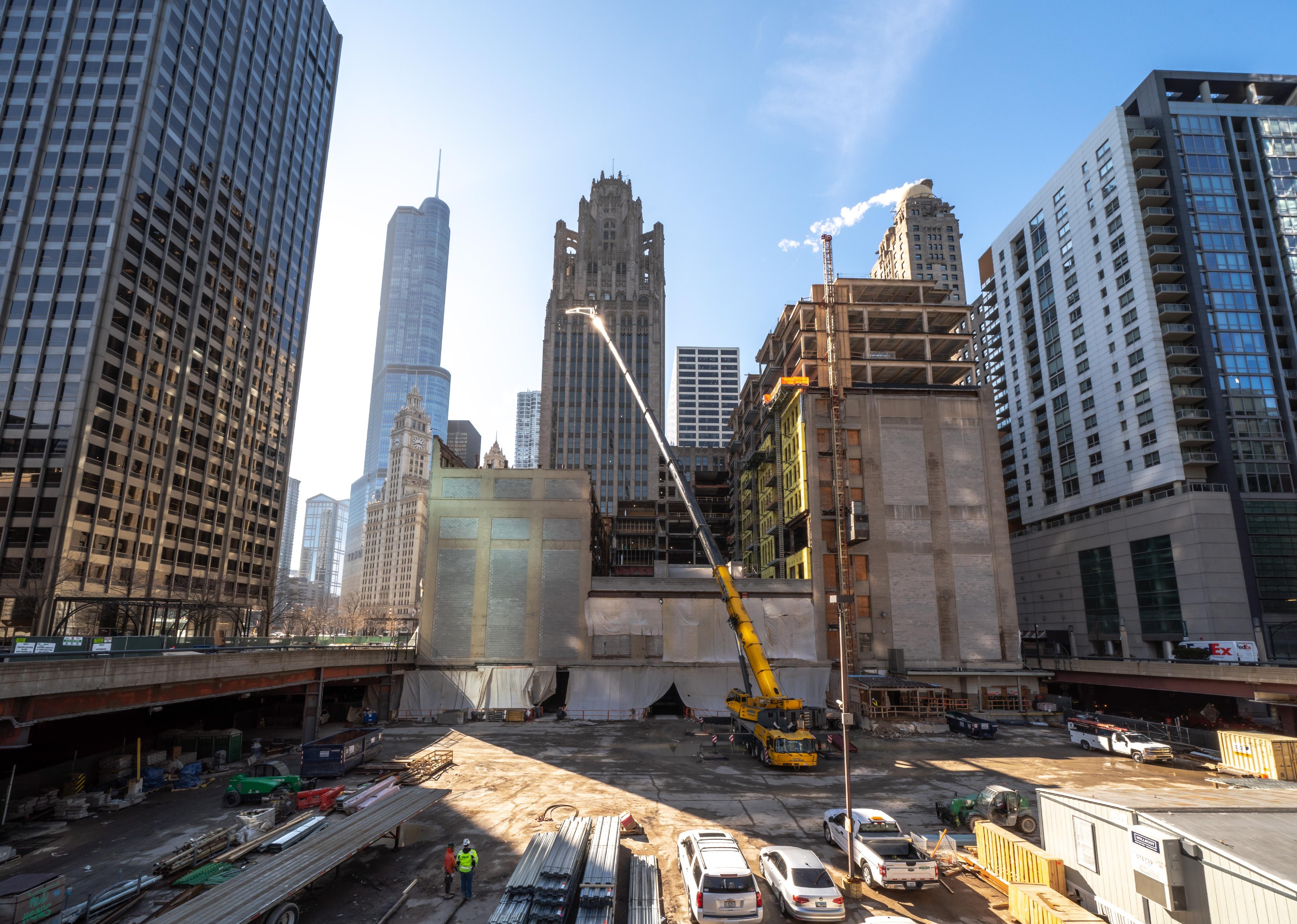Construction workers converting the Tribune Tower in Chicago into residential condominiums in downtown.