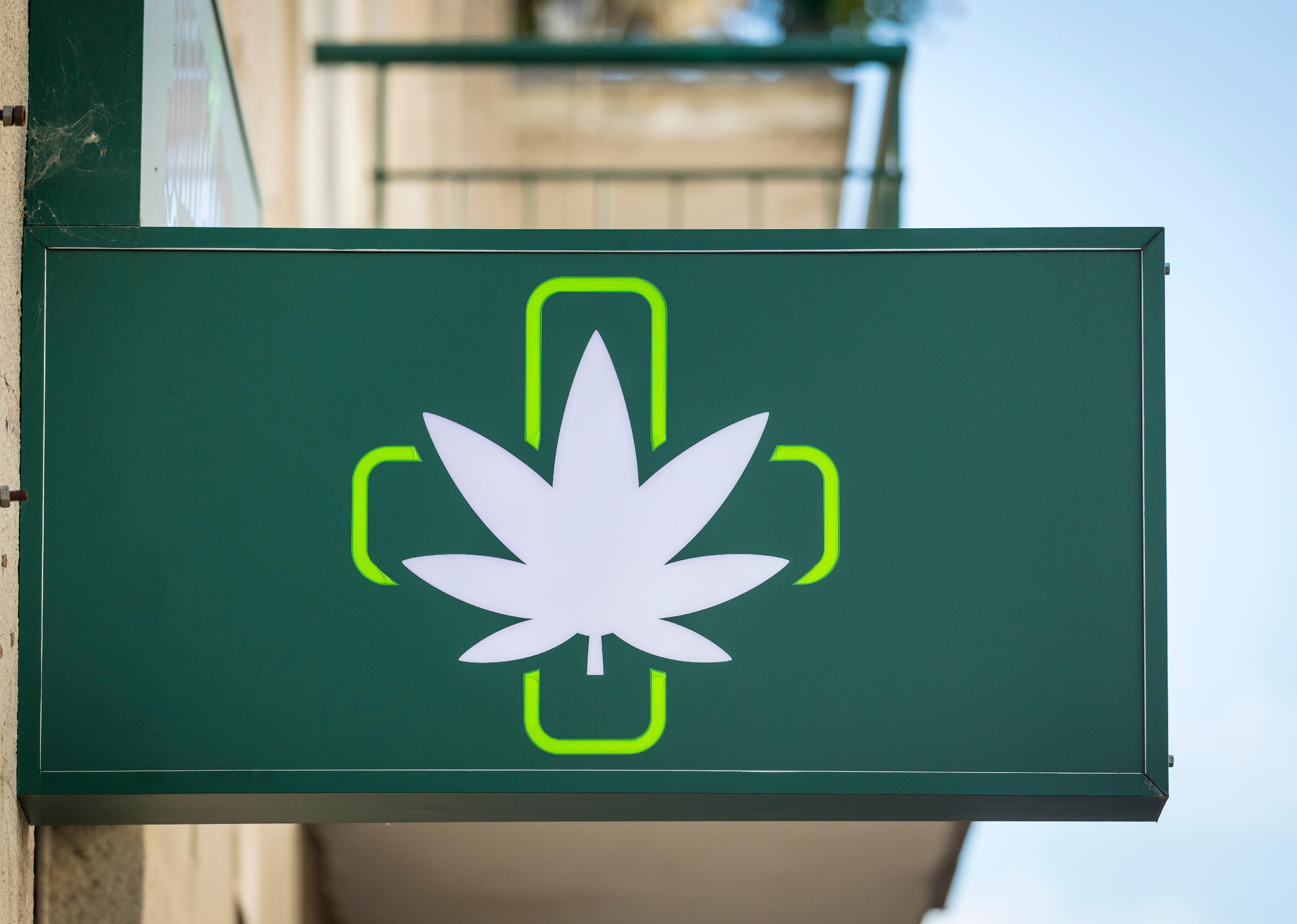 Dispensary sign on building.