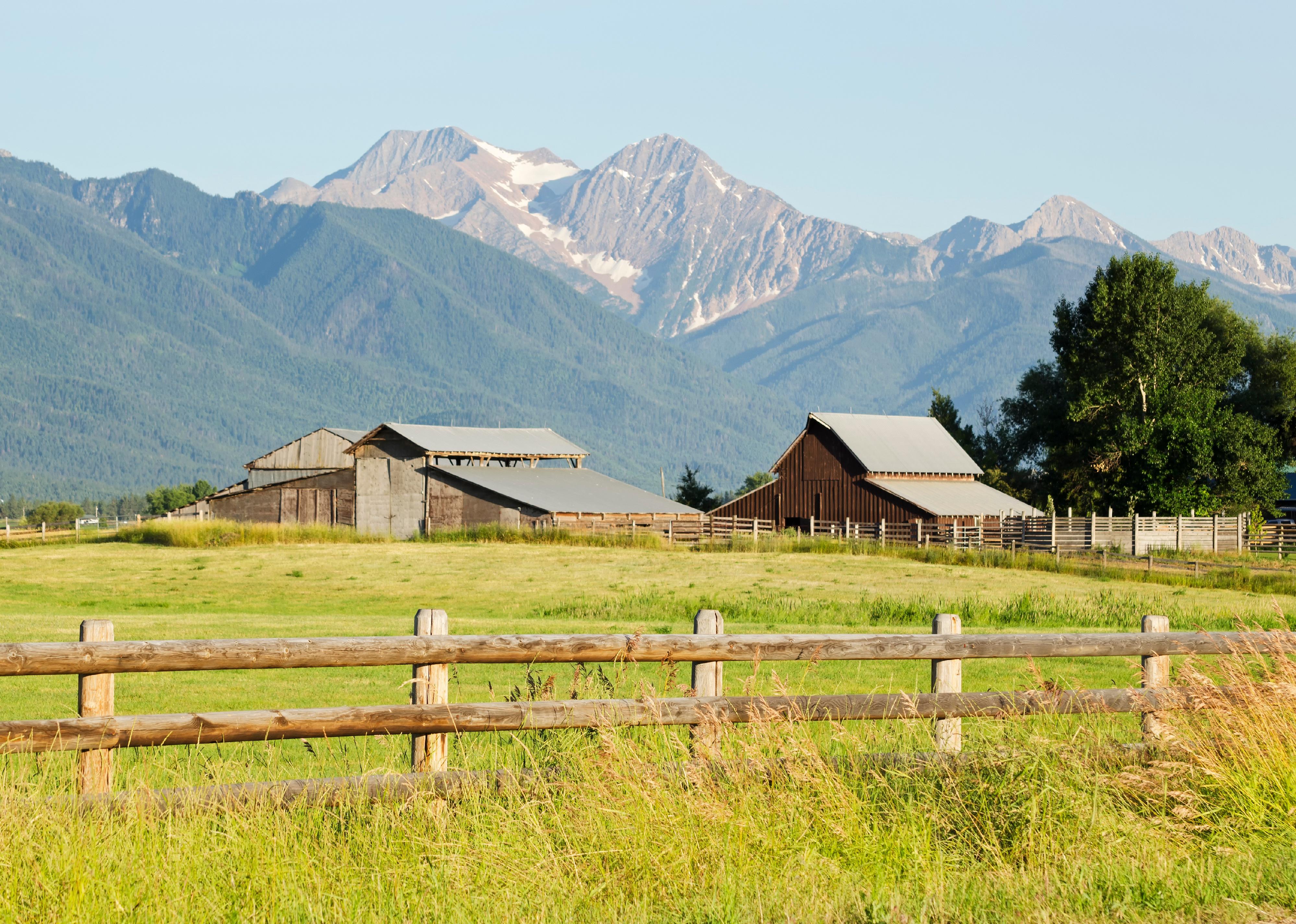A ranch somewhere in Montana nestled beneath majestic mountains.